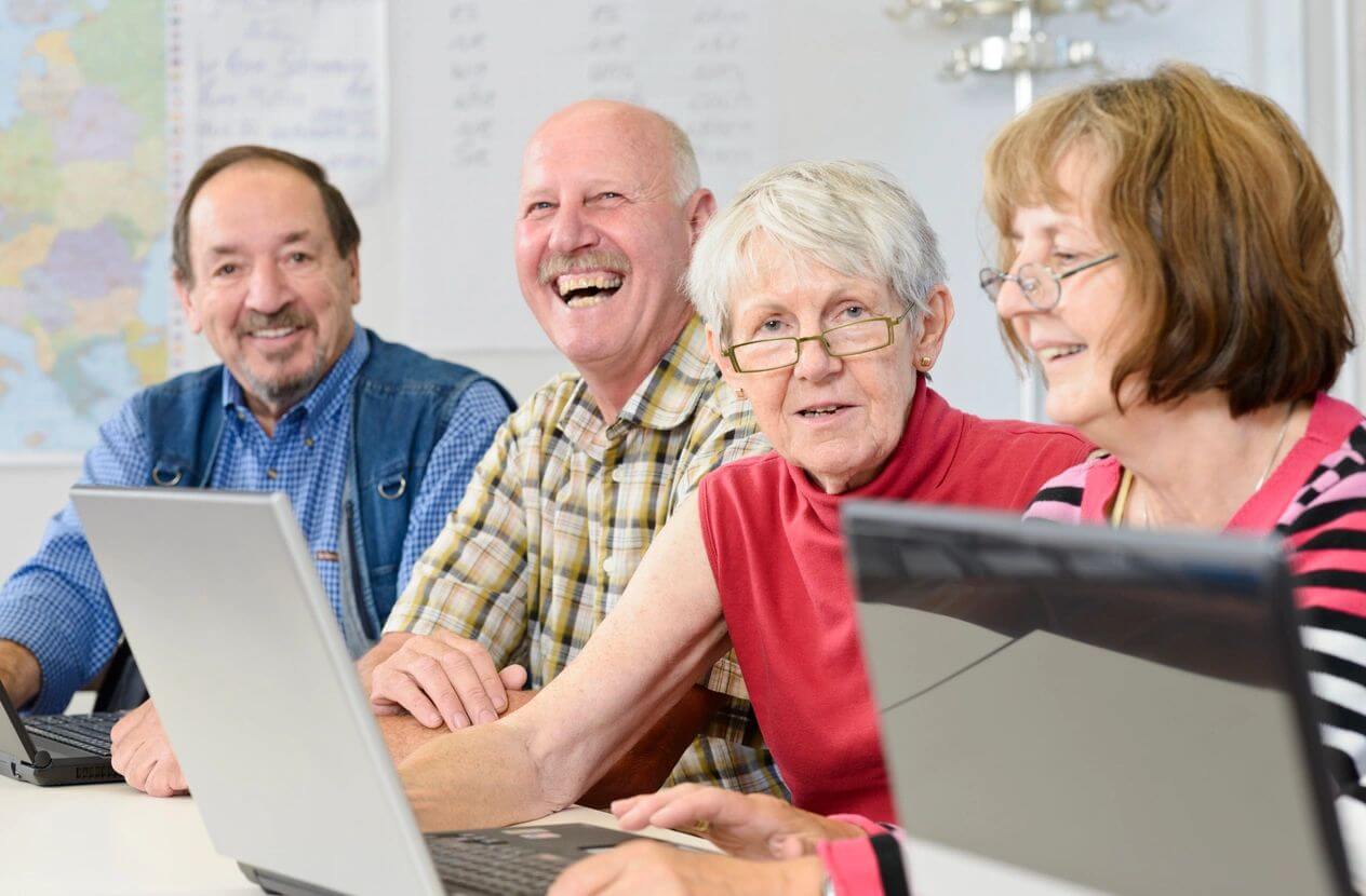 Group of senior people learning computer